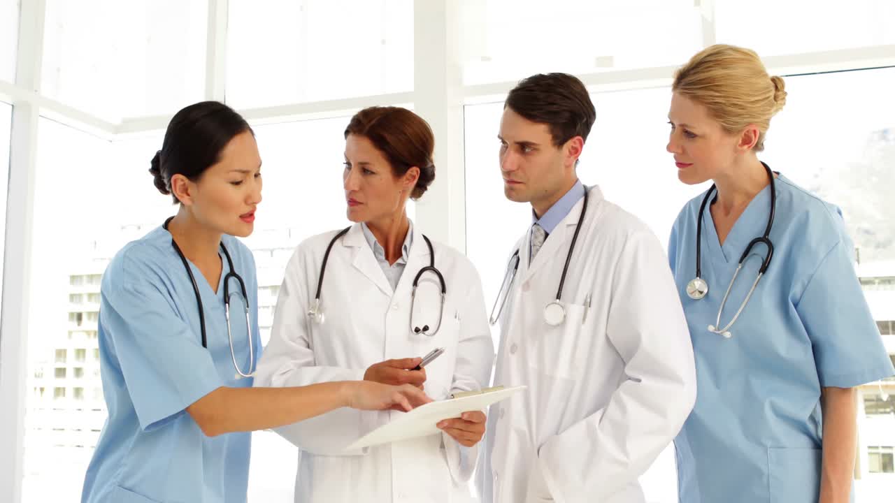 Medical team discussing a file