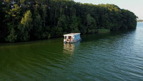 house boat floating on a lake in brandenburg, germany