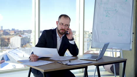 serious businessman working with documents. man working everyday job at modern office