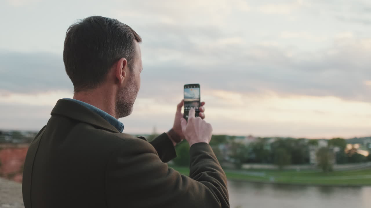 Man taking photos with his smartphone