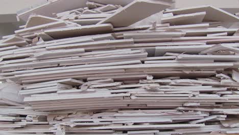 plasterboard scraps piled up on pallet