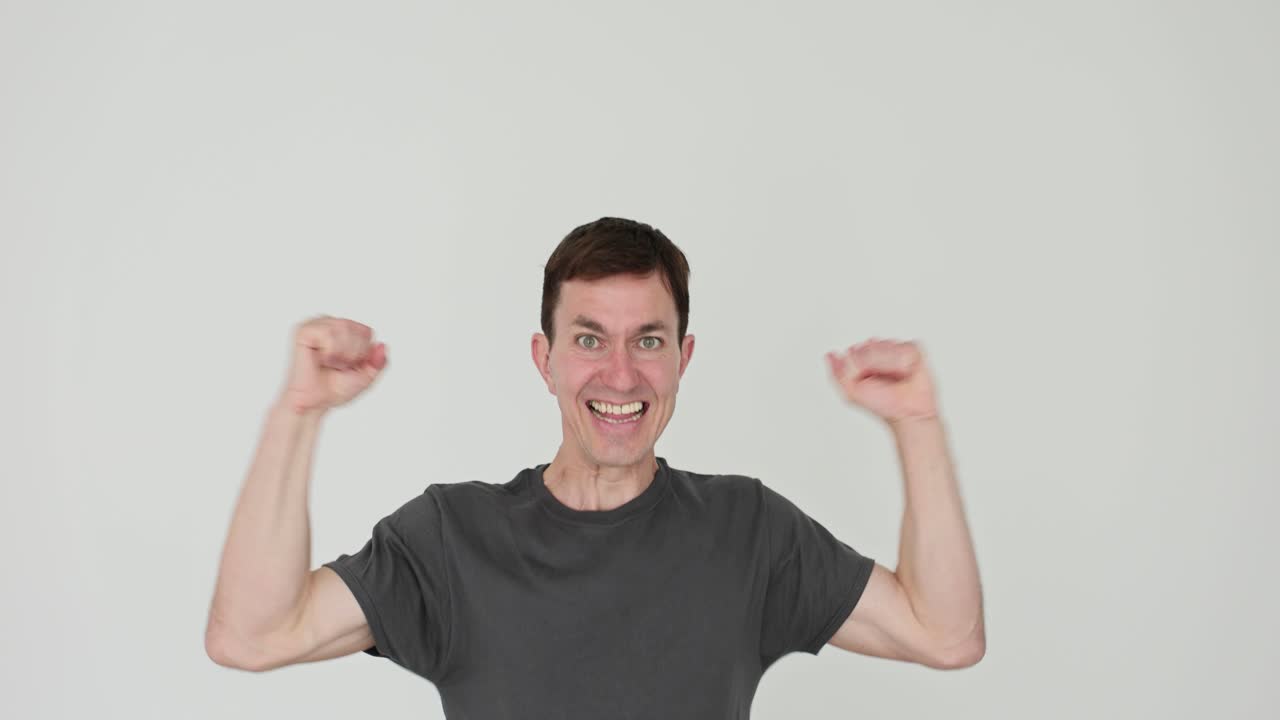 Excited Man Jumping and Cheering