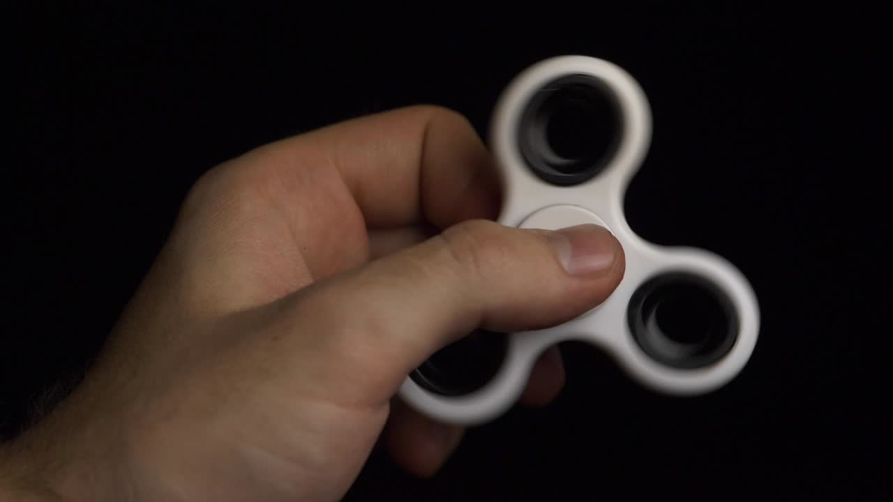Hand holding a fidget spinner