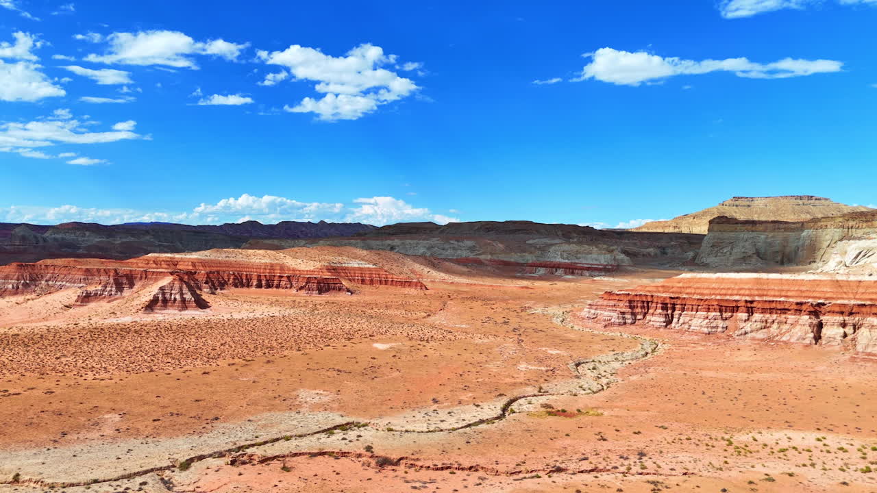 Rising over the dry hot deserted landscape on sunny day. Revealing view on the layered rock formations in the scenery of Arizona, USA