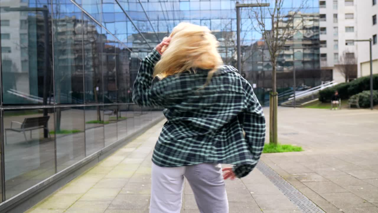 Woman with Blonde Hair Posing on City Street