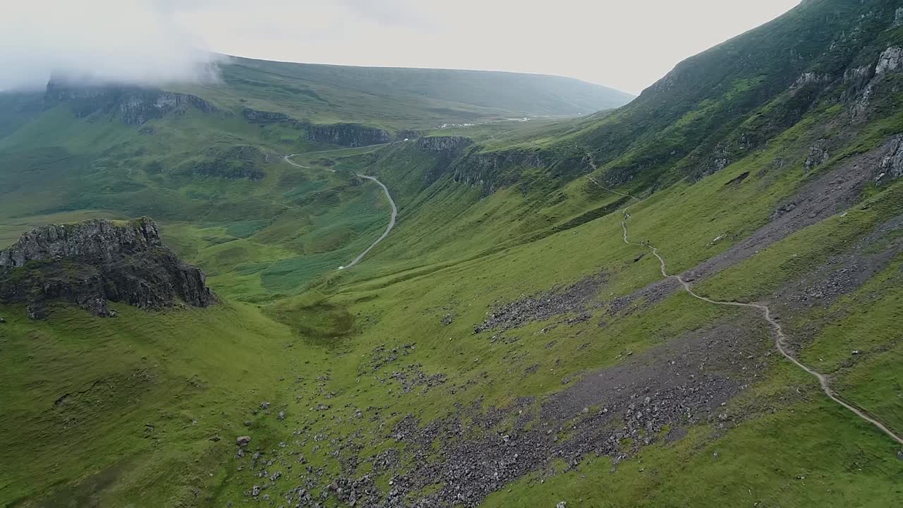 the quiraing  is a landslip on the eastern face of isle of skye, a lot of paths covered the volcanic area, this clip is recorded by a drone