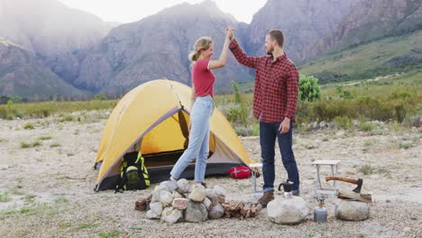 caucasian couple camping in nature