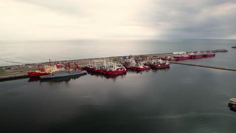orbit view of fleet of boats in port,breakwater mar del plata, argentina