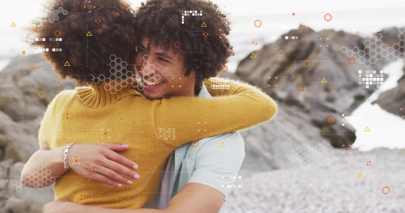 Couple exchanging quiet gesture on stone shore and embracing for mental health on rocky coast