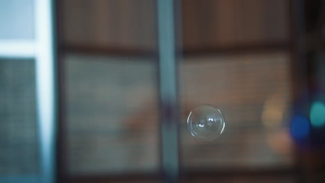 bubble appears from behind other bubble in slow motion