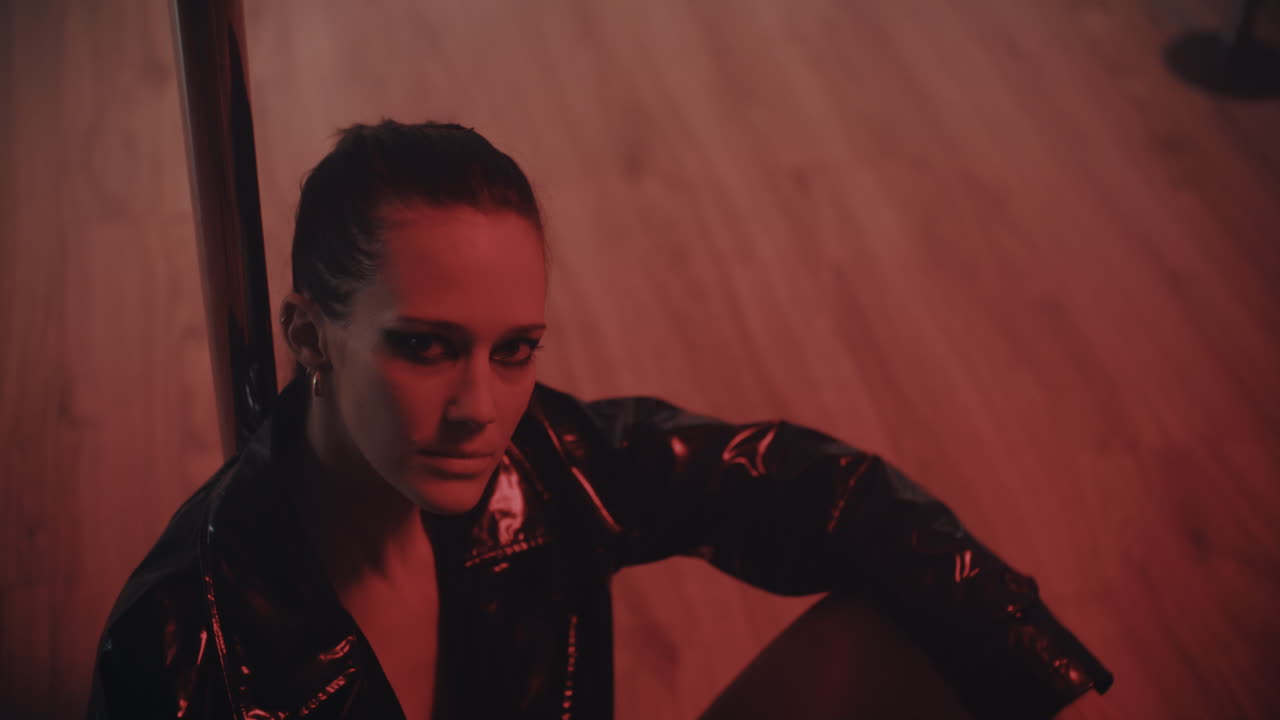 Woman Pole Dancer in Red Light