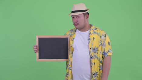 joven, guapo y gordo turista asiático