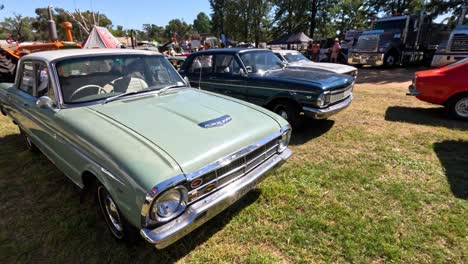 vintage cars displayed at an outdoor event