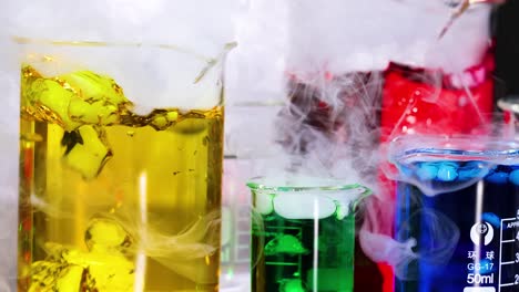 vibrant liquids reacting in laboratory beakers