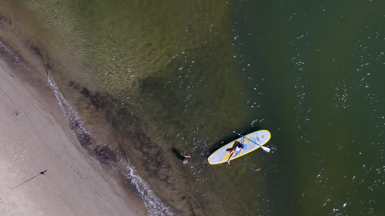 Aerial View of Paddleboarding on a Sunny Day