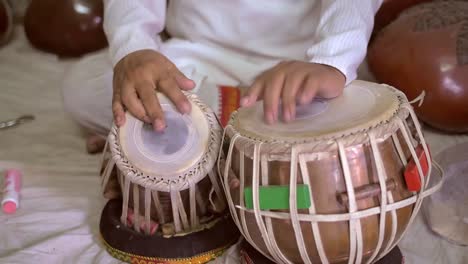 hands playing traditional indian drums