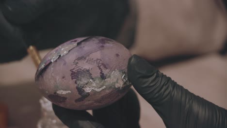 woman decorating colorfull easter egg