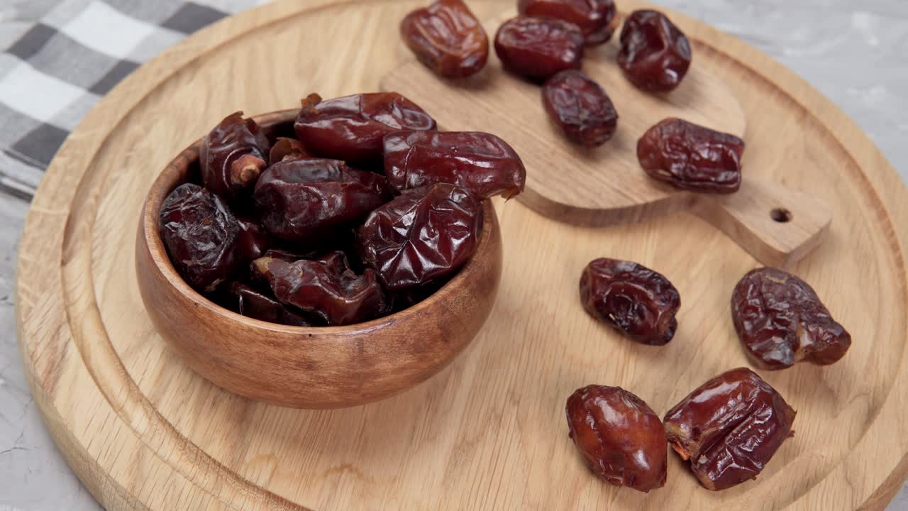 Dry date in a bowl. Ramadan Kareem with dates selective focus