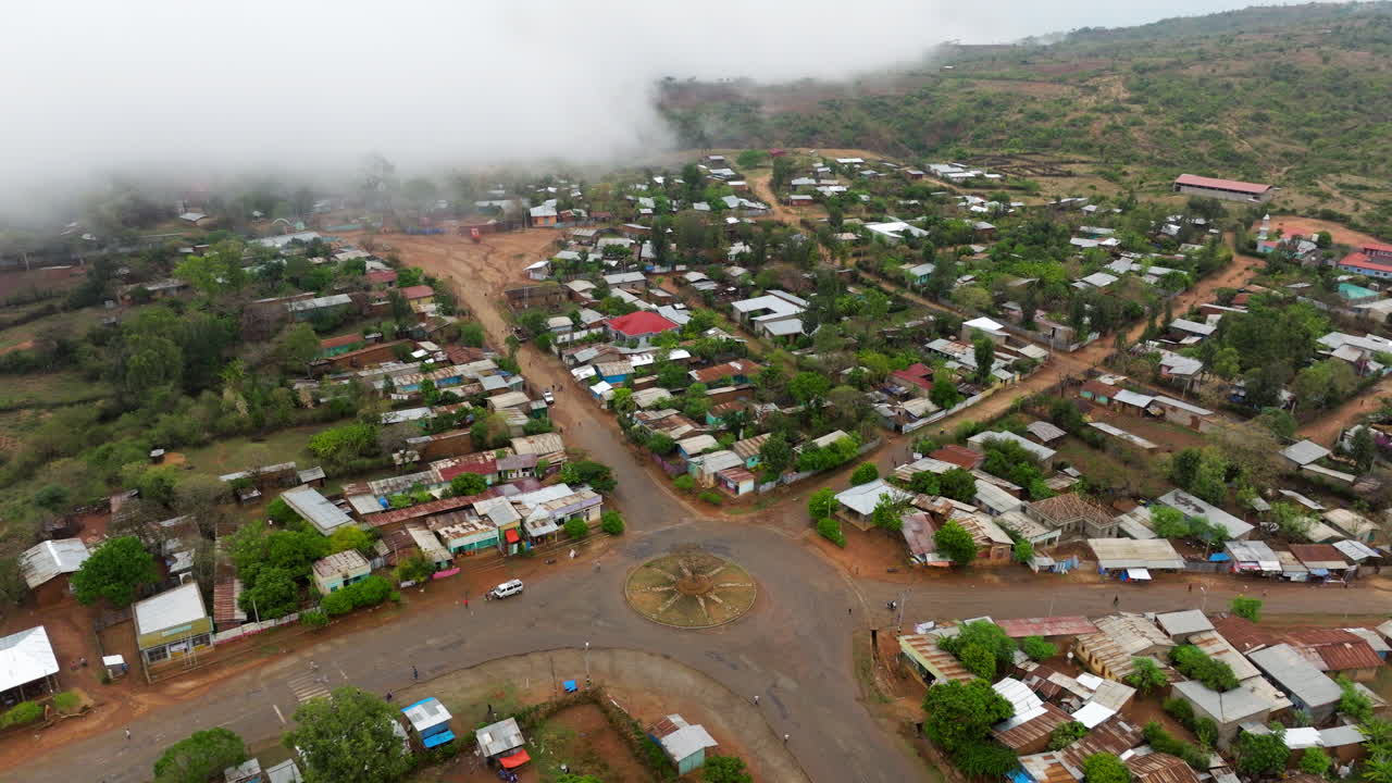Drone reveals people and rooftops in Key Afer