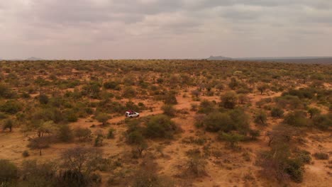 a 4x4 offroad car driving through samburu land in northern kenya