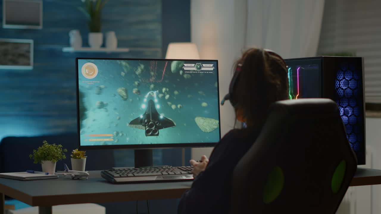 여성 게이머가 전문 무선 컨트롤러를 사용하여 비디오 게임을 승리