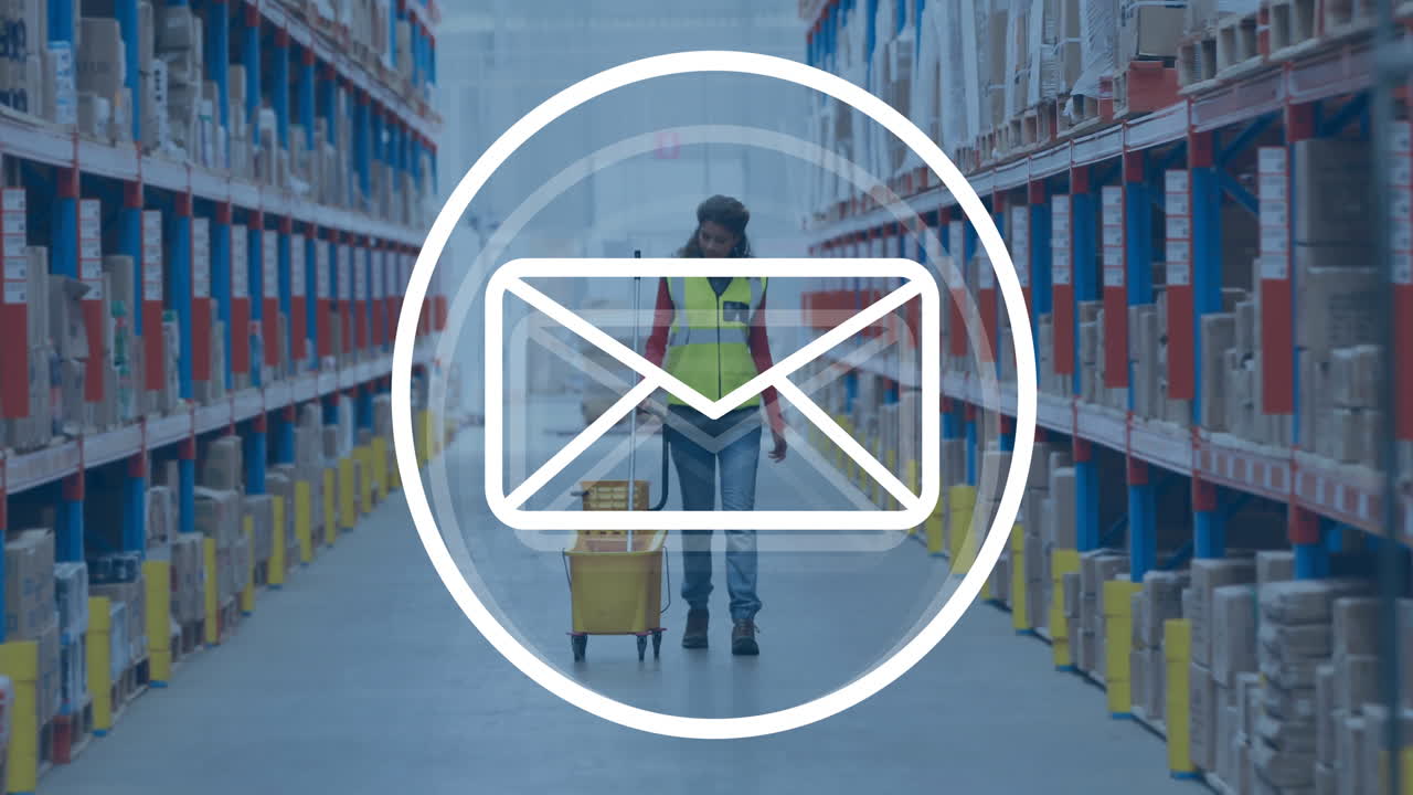 Animation of envelope icon over biracial female worker in warehouse