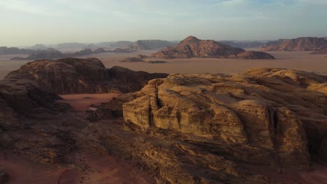 wadi rum mountain landscape at sunset, jordan, aerial forward dolly