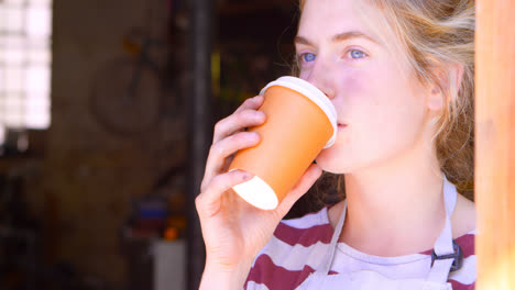 woman having a coffee at workshop 4k