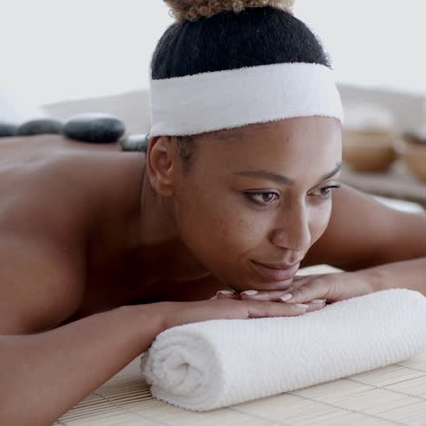 Woman-Getting-Hot-Stones-Massage-At-Spa