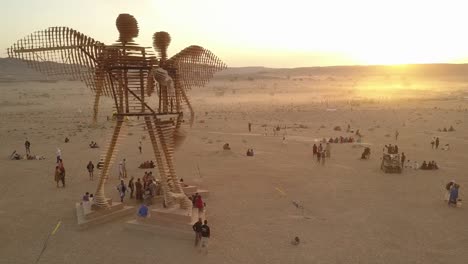 giant wooden angel sculpture at burning man festival