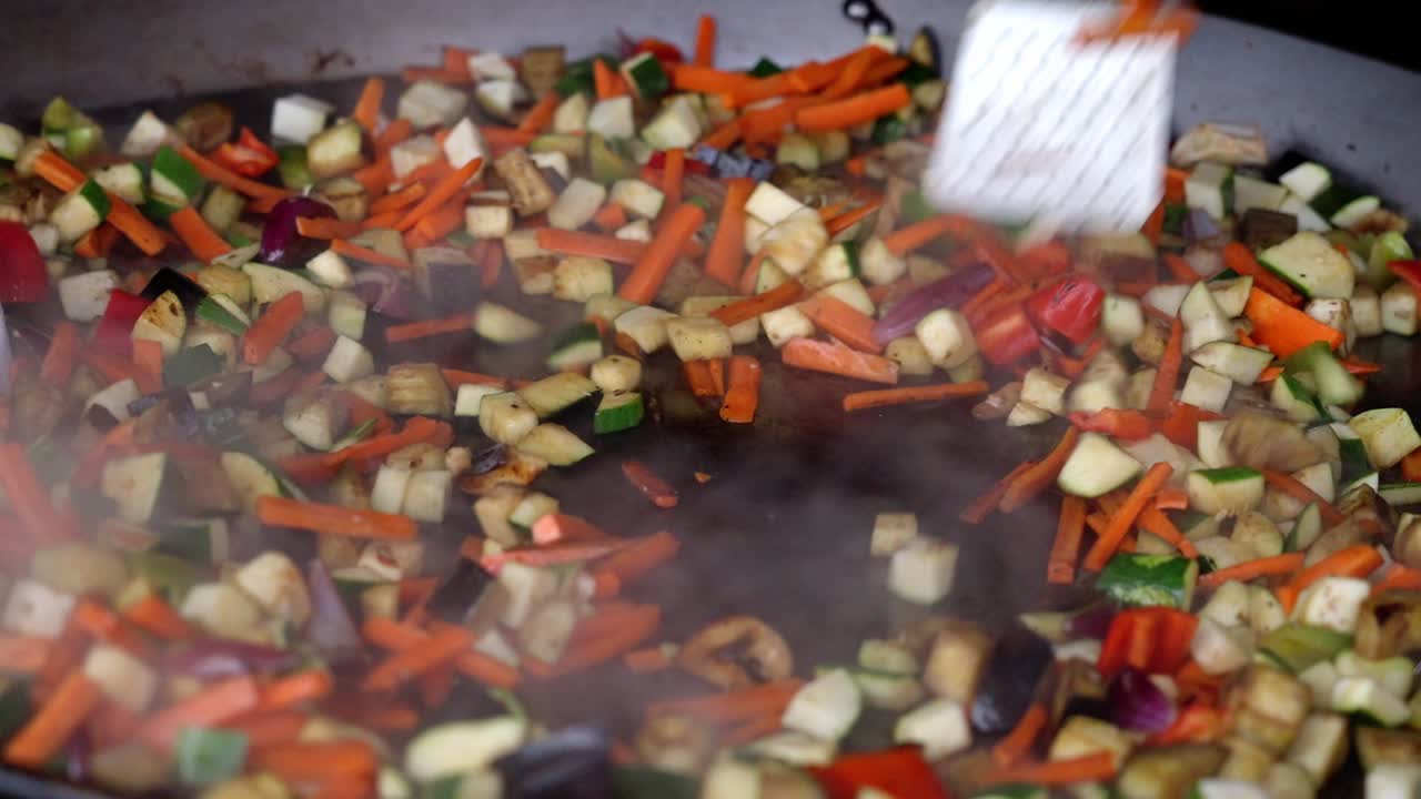Stir-fried mixed vegetables cooking in a pan