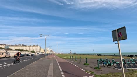 cyclists riding along brighton seafront bike path