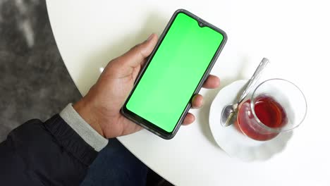 Close-up-of-young-man-hand-using-smart-phone