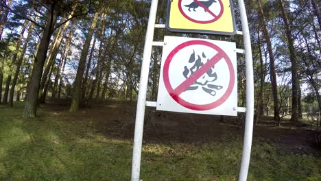 prohibiting signs near lake. no dogs no fire no jump water. 4k