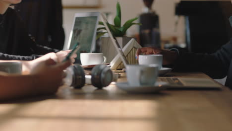 close up business people hands students using computer technology in cafe browsing working together brainstorming creative project ideas studying online research enjoying busy coffee shop