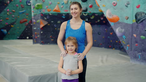 mother and daughter at climbing gym