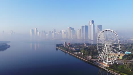 view from above of sharjah's khalid lake, eye of emirates, sharjah skyline on a foggy morning, united arab emirates, 4k video