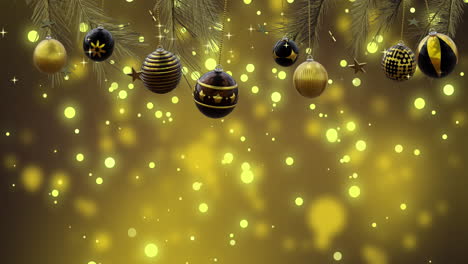 christmas tree with swinging black and gold baubles over yellow bokeh and light spots, copy space