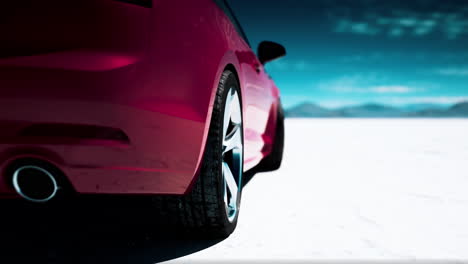 pink car on a salt flat