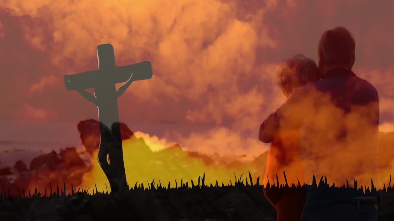 Silhouette of person with cross against vibrant sunset sky with animation clouds