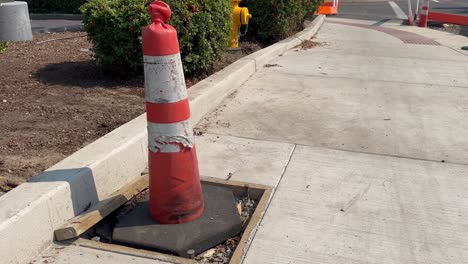 new sidewalk with road cones protecting traffic