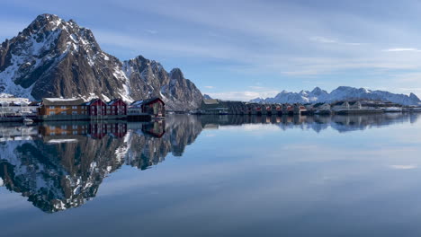 Mountain-reflecting-on-the-water-surface-in-the-harbor-of-Svolvaer,-sunny-day-with-blue-sky,-Static-Shot-4k-Lofoten