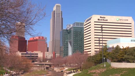 downtown omaha nebraska skyscrapers rise above a city park