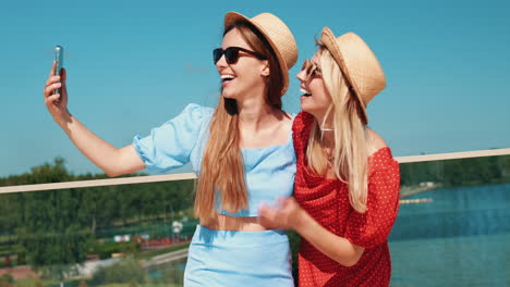 two friends taking a selfie outdoors