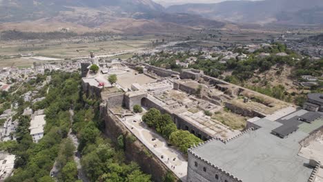 Aerial-view-of-the-hilltop-Castle-of-Gjirokastra,-Albania