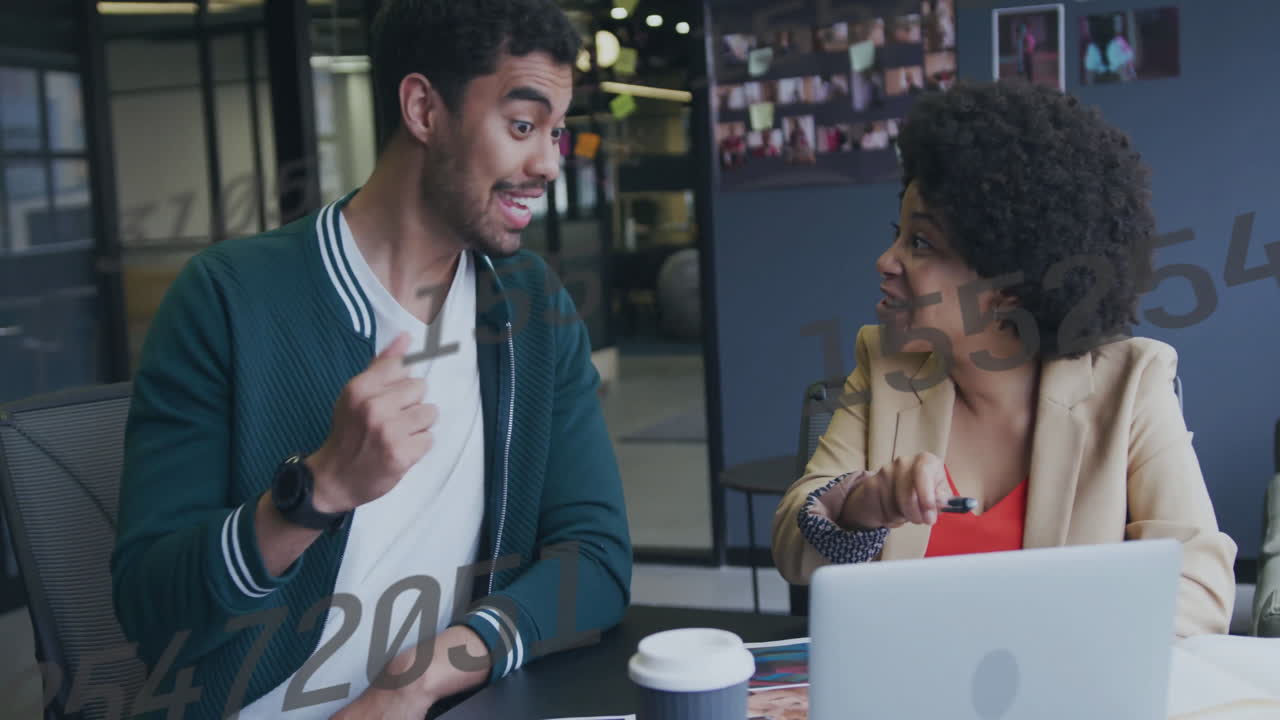 Animation of data processing over biracial colleagues discussing work
