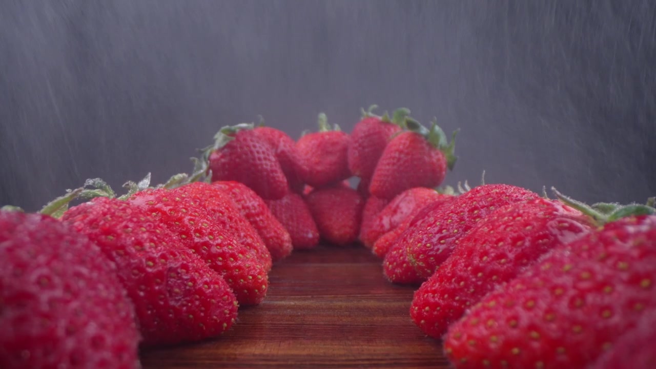 Close-up of Fresh Red Strawberries with Water Spray