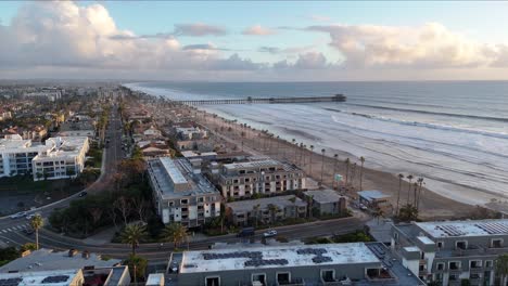 Aerial-footage-of-Oceanside,-California,-at-sunset