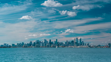 Australia-Victoria-Melbourne-City-look-from-Williamstown-Blue-sky-with-high-rise-buildings-and-sail-boats-going-past-timelapse-graceful-footage