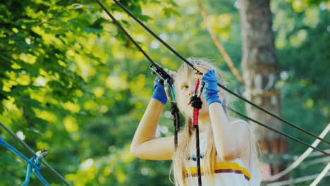 a brave child takes steps on a staggered cable at a height overcome fear concept